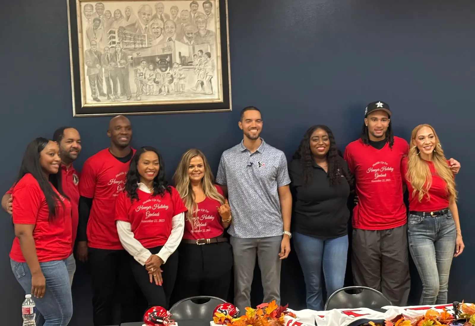 DeMeco and Jamila Ryans with foundation leaders and community partners at Huddle Up for Hunger 2026